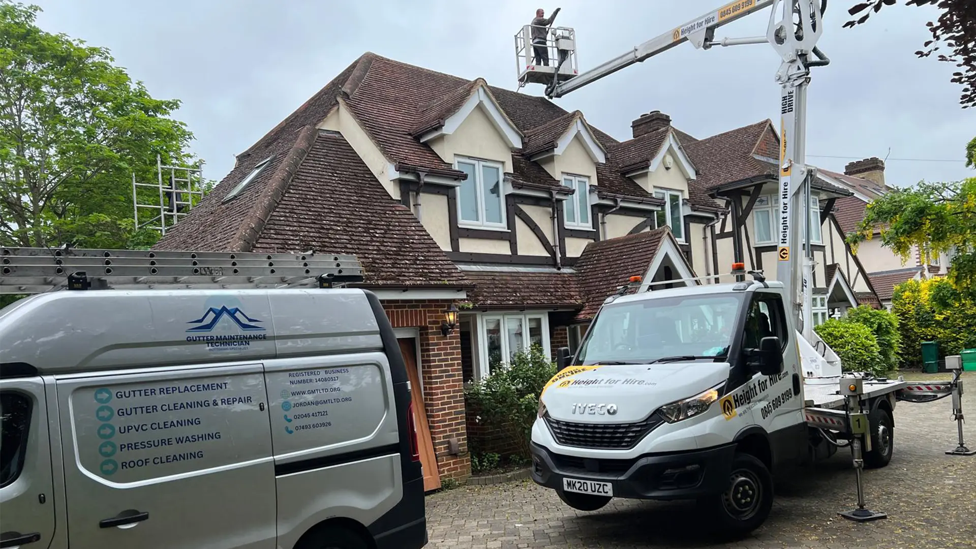 Professional gutter cleaning technician working on residential property in Kent and South East London